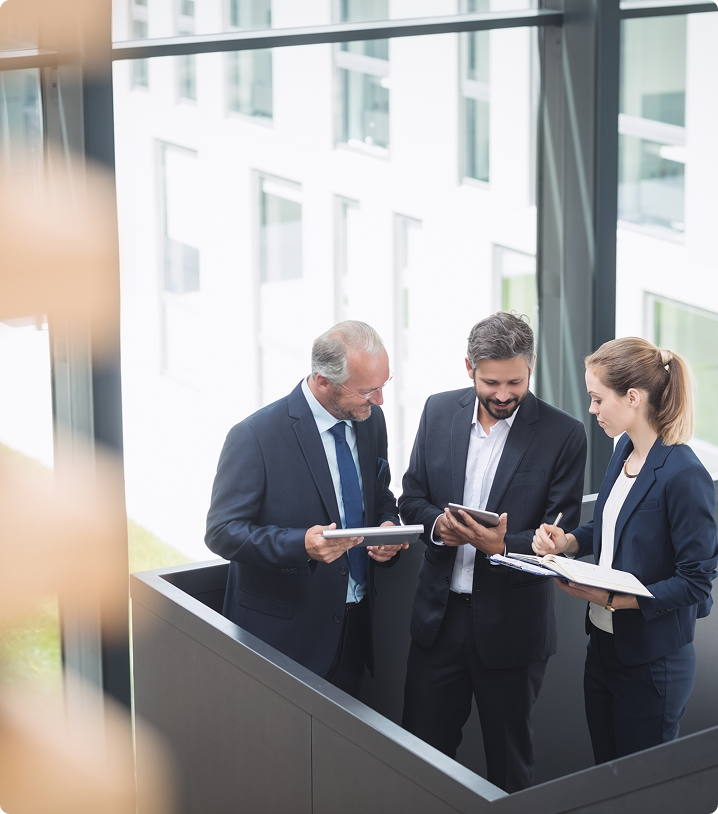 Professionals discussing documents in an office